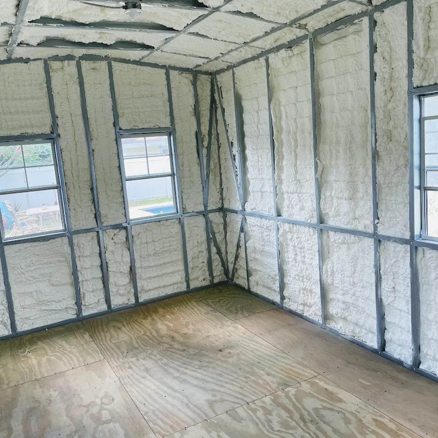 Closed-cell spray foam insulation applied to wall cavities in a residential project in Edgewater